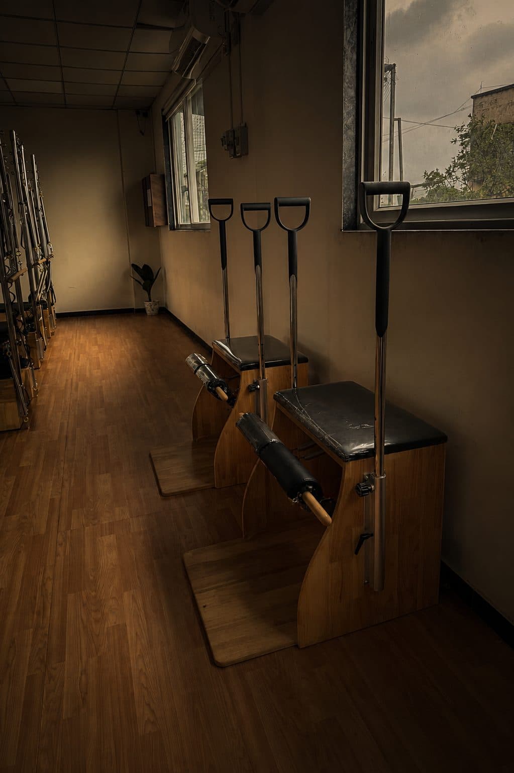 Wunda chairs and Pilates apparatus along the studio corridor